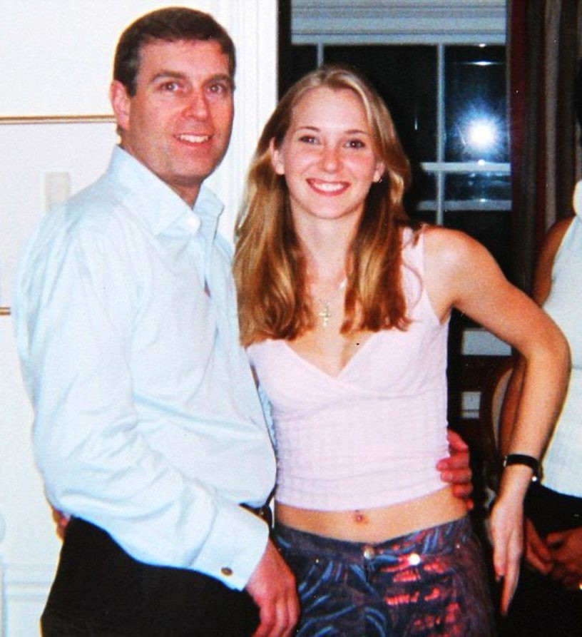 Prince Andrew has suggested that the photo of him with his arm around 17-year-old sex slave Virginia Roberts is fake