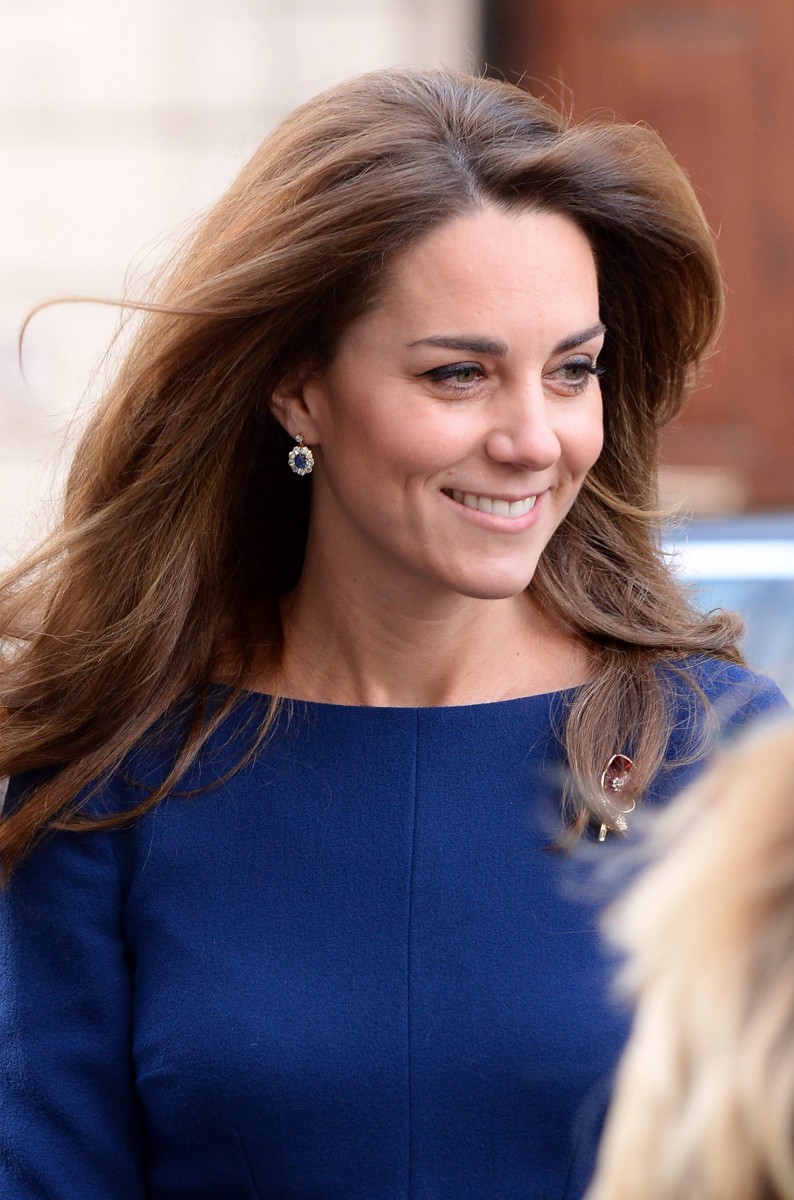 The duchess smiles as she is greeted