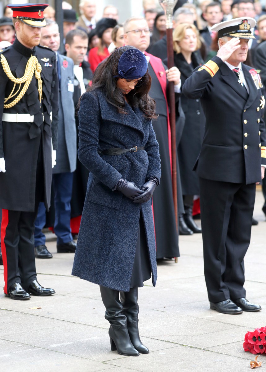 Meghan bows her head in memory of those fallen