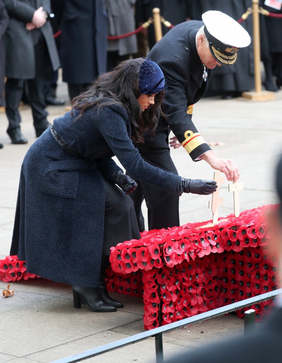 Meghan Markle places a cross during the service