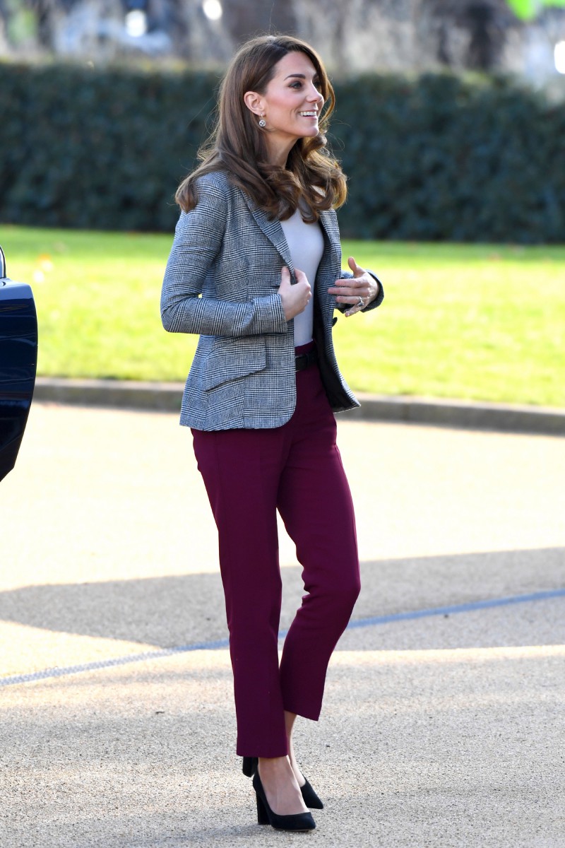 The Duchess of Cambridge looked stylish in burgundy trousers and monochrome jacket