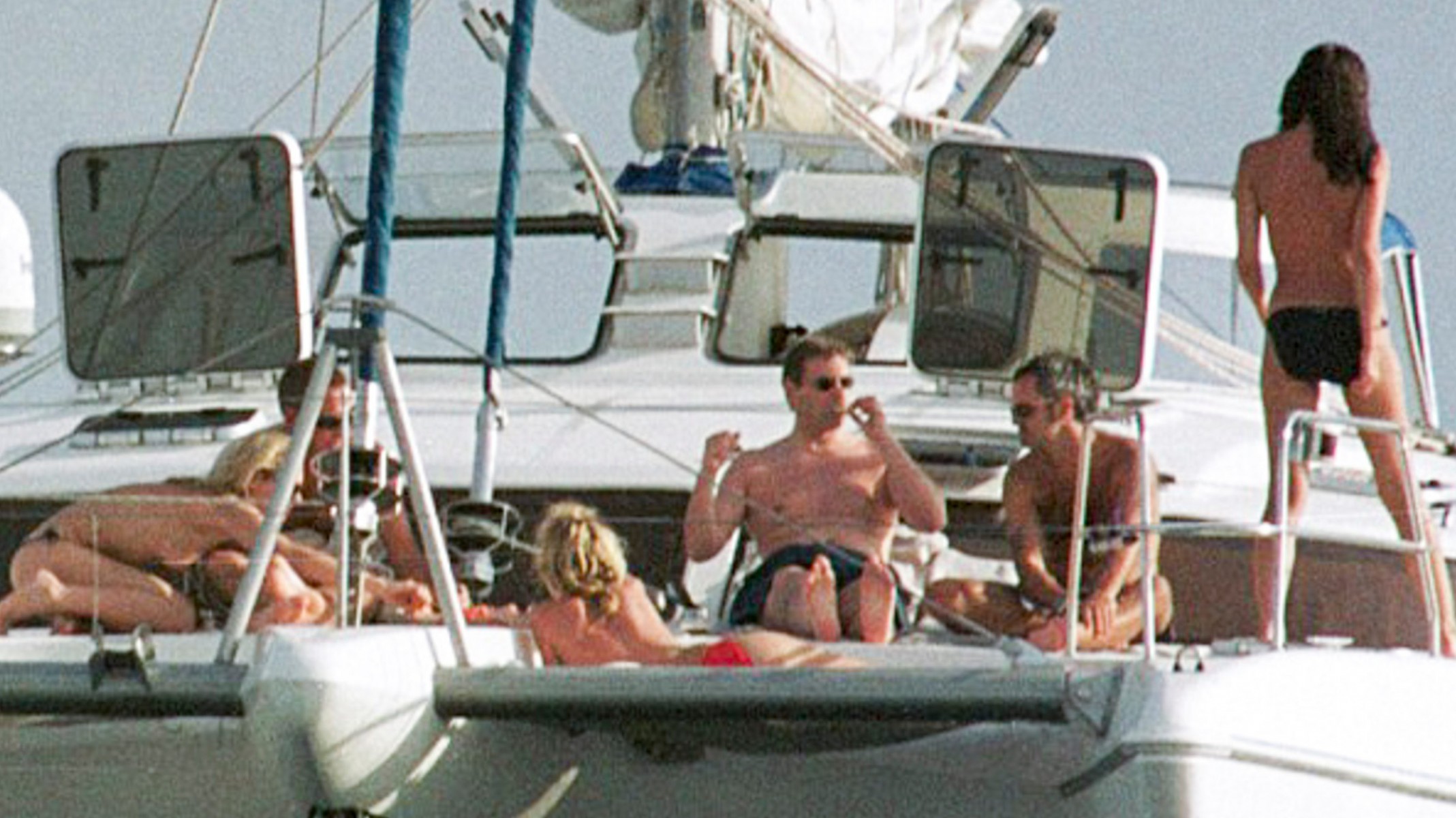 Prince Andrew third from right on a boat with topless women in Phuket in 2001