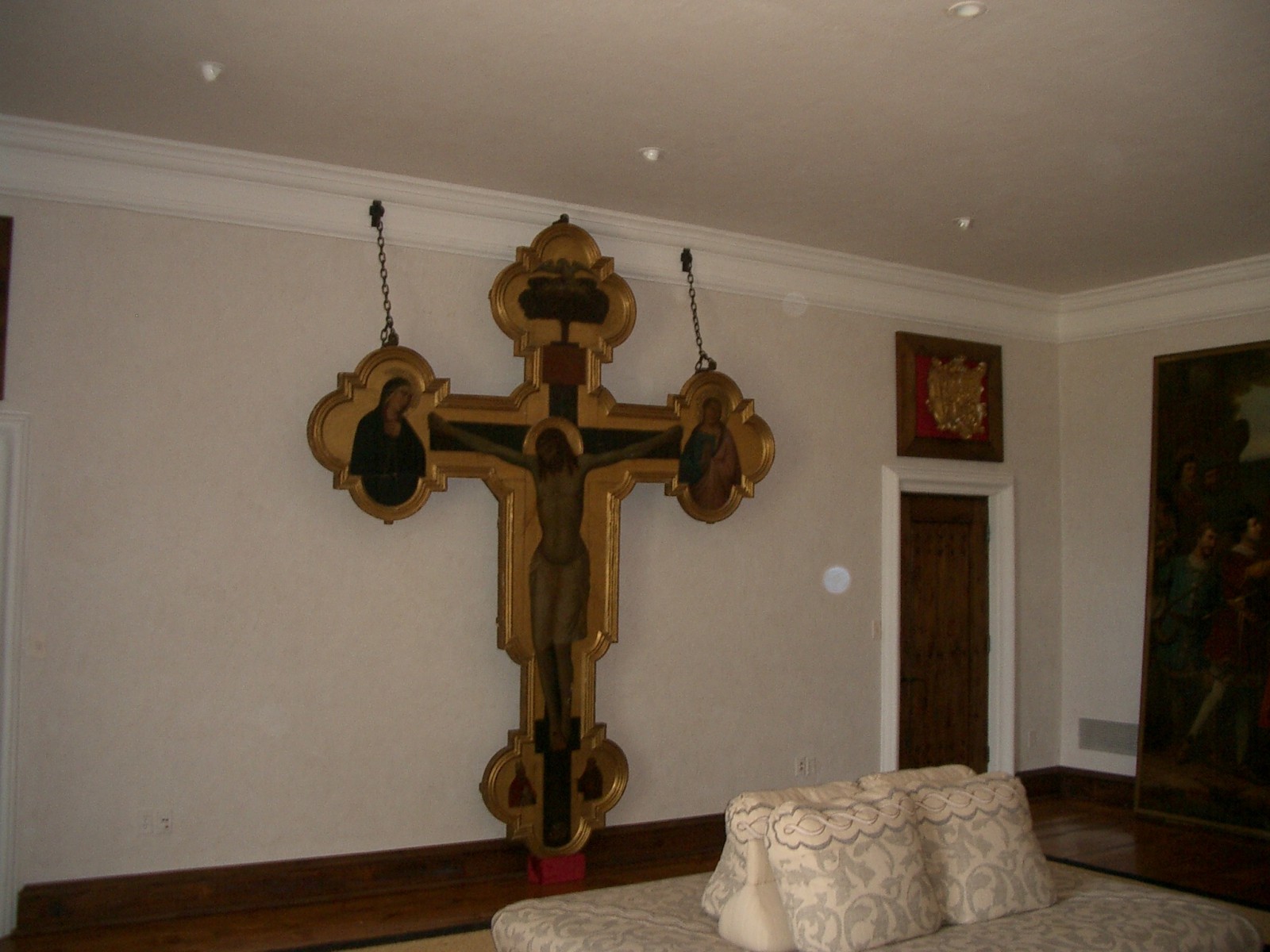  In one bedroom there is a sculpture of a life-sized Jesus crucified on a golden cross
