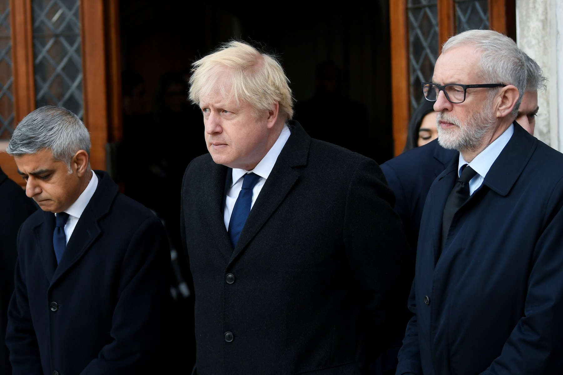 Sadiq Khan, Boris Johnson and Jeremy Corbyn honour a minute's silence at London's Guildhall today