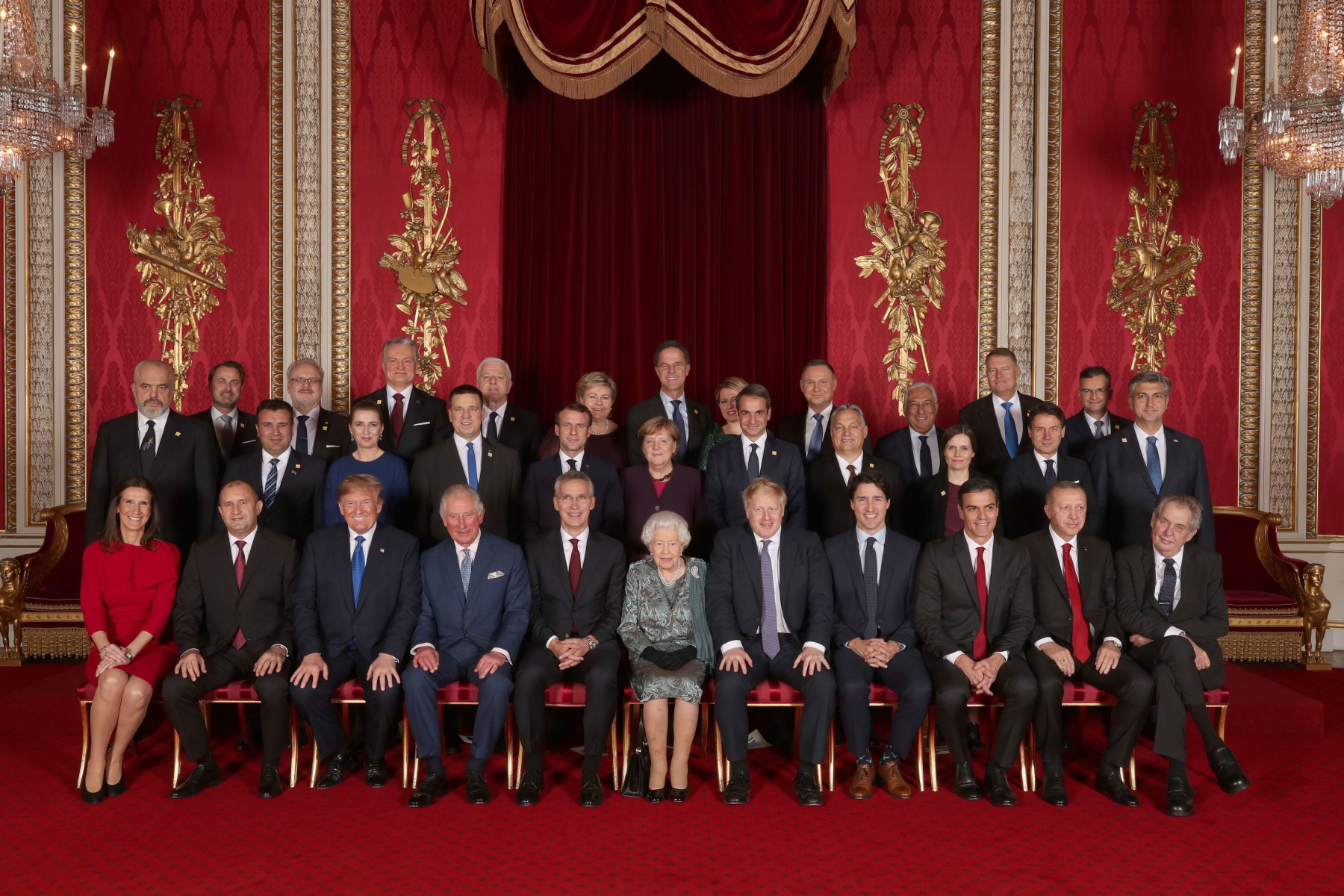 Leaders pose for a group photo at Buckingham Palace