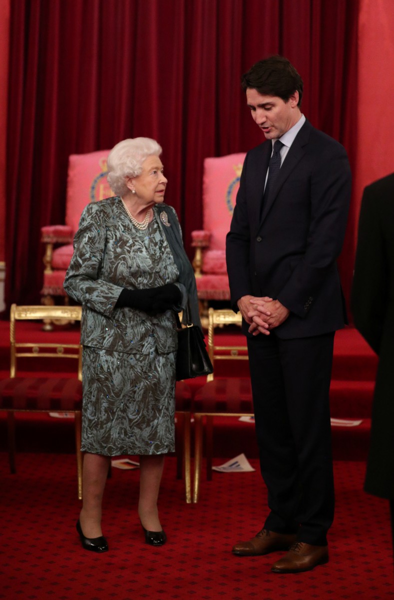 The Queen speaks to Justin Trudeau last night during the reception
