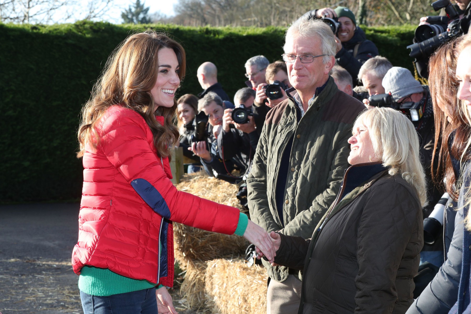The royal grins as she meets locals