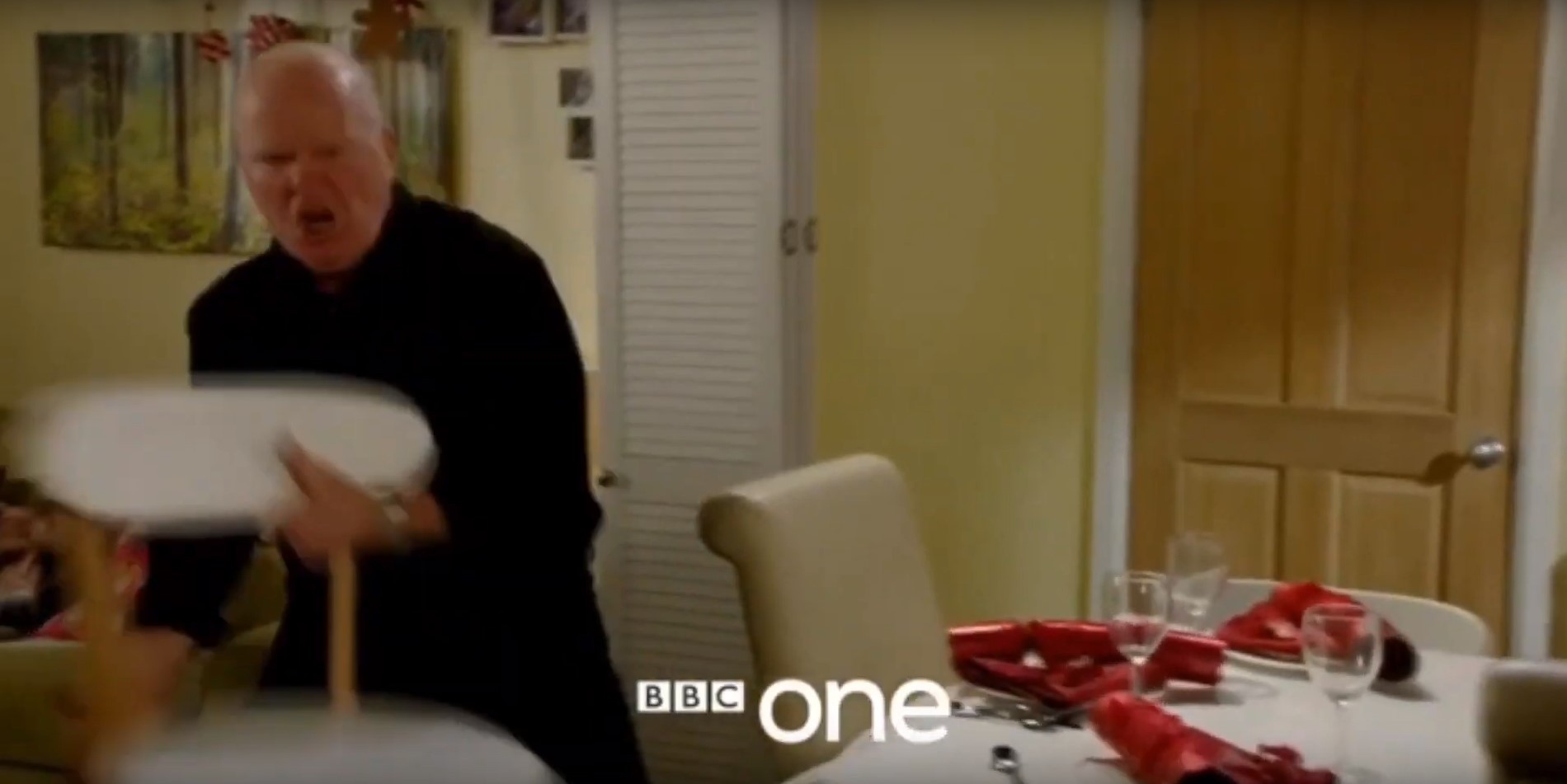 Phil hurls a chair across the Christmas table in <a href='https://amzn.to/2VTHfkk'></img>EastEnders</a>” width=”960″ height=”481″ /><figcaption class=