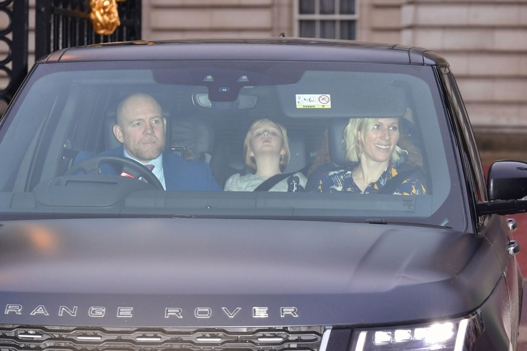 Mike wasn't drinking at the event, seen here driving his family to the palace 