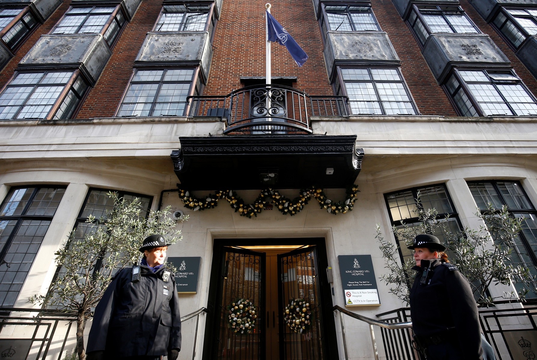 Police officers stand outside King Edward VII's Hospital, where Britain's Prince Philip was admitted