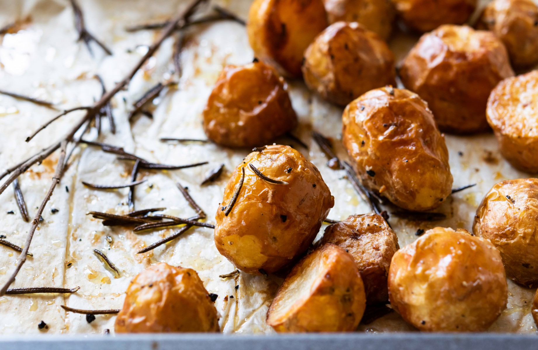 The ensure our potatoes are crispy, make sure you partially boil them before shoving them in the oven