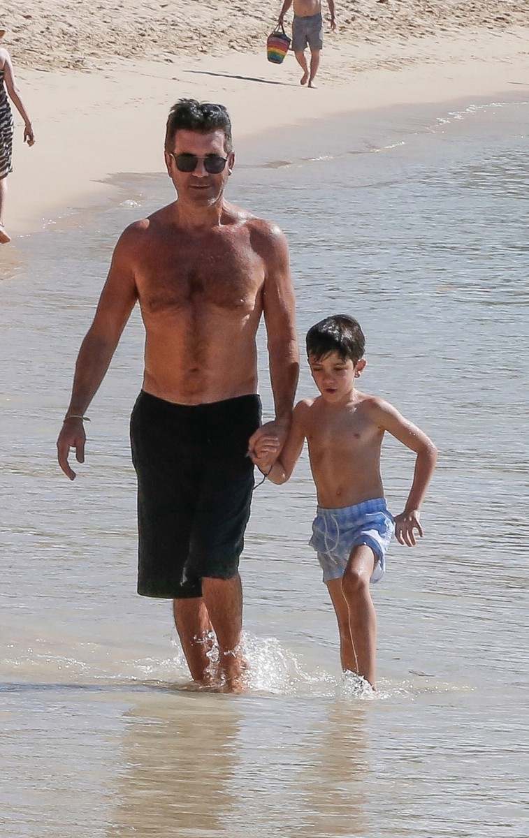 Simon Cowell has been soaking up the Caribbean sunshine with girlfriend Lauren Silverman and son Eric