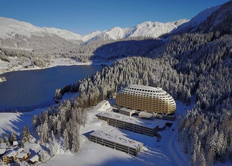 The hotel is nestled into the mountains of Davos