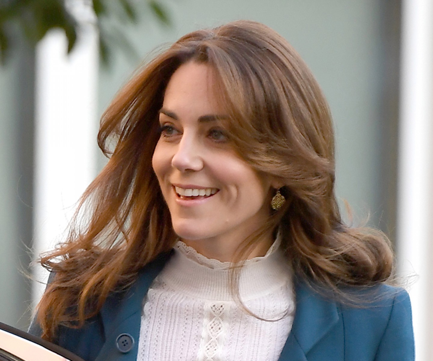 Kate Middleton smiles as she arrives to discuss the project with staff from LEYF