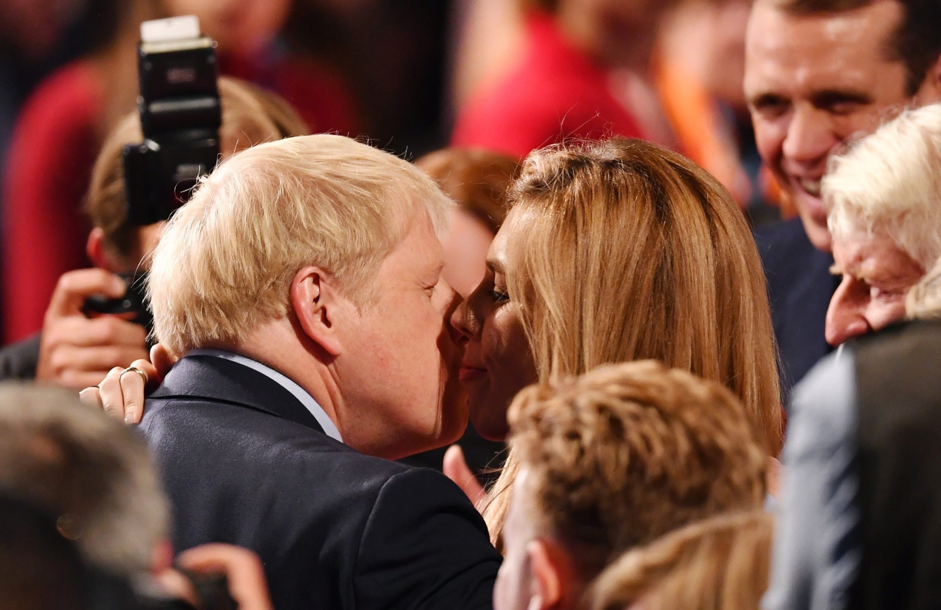  Boris Johnson embraces his girlfriend Carrie Symonds following his keynote speech at the conference