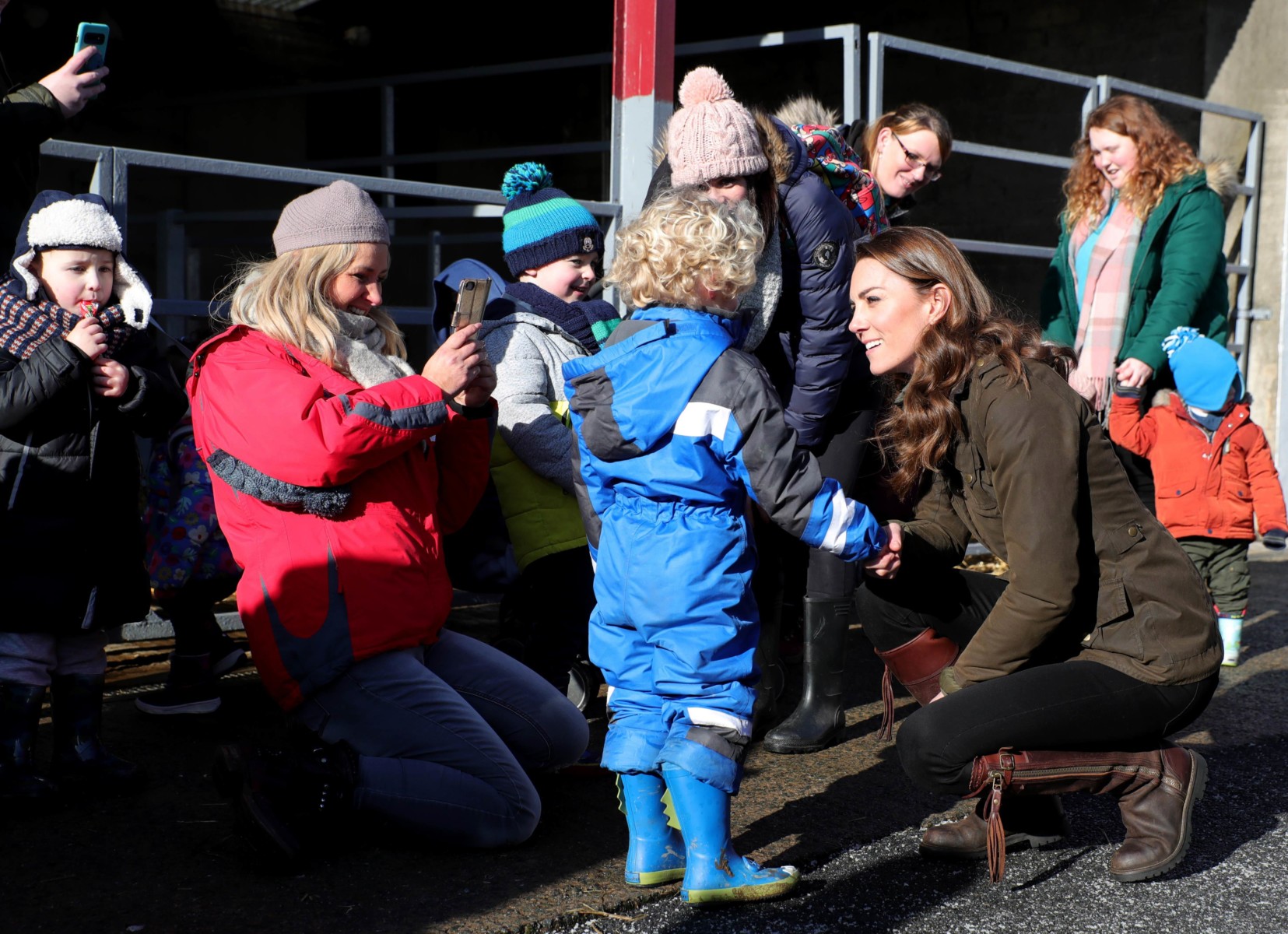 Kate Middleton immediately crouched down to chat to some of the younger members in the crowd waiting to meet her