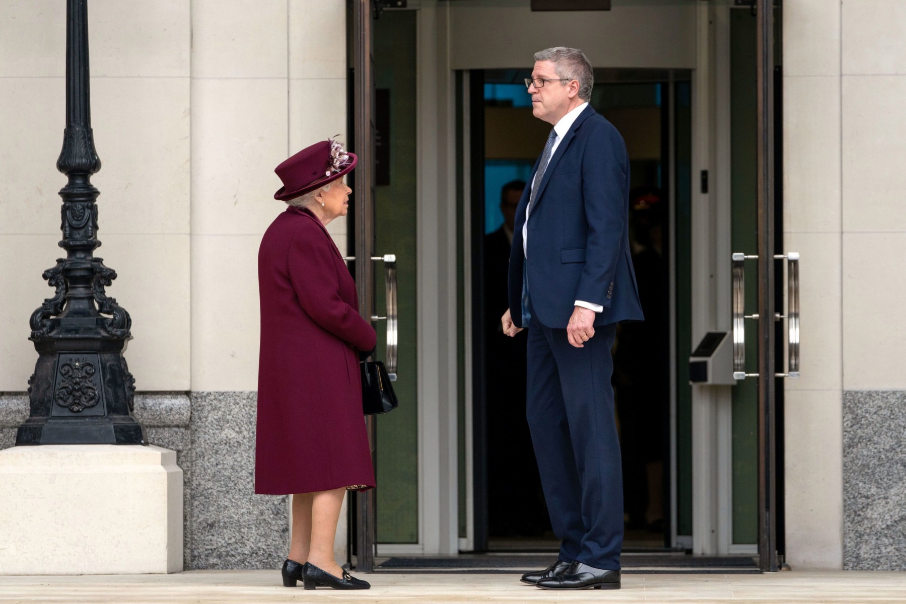 The Queen speaks to Director General Andrew Parker after the visit