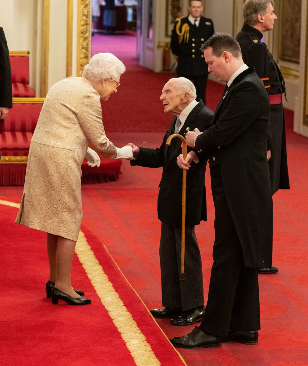 This is the moment Horace 'Harry' Billinge met the Queen today while accepting his MBE
