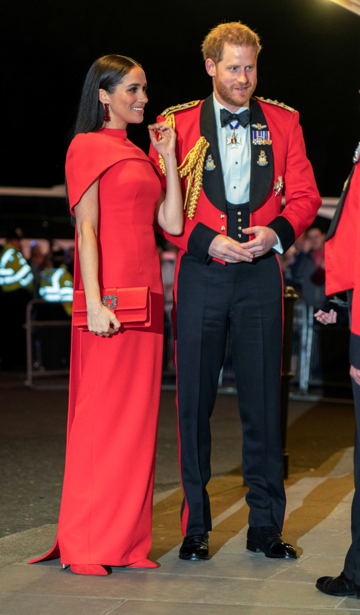 The Duchess of Sussex attended The Mountbatten Festival of Music in London in a red £1,295 floor-length cape dress by Safiyaa