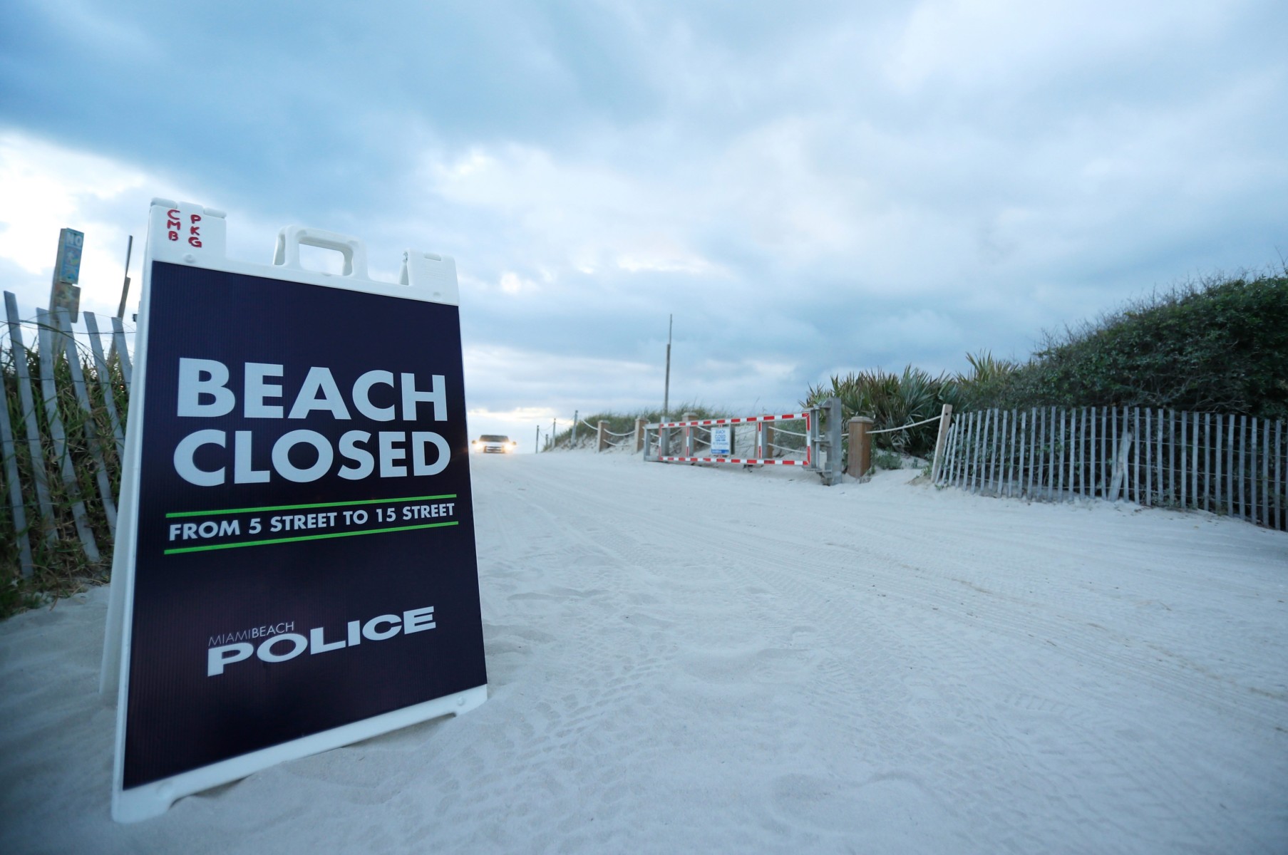 A sign shows a Floria beach is closed to the public