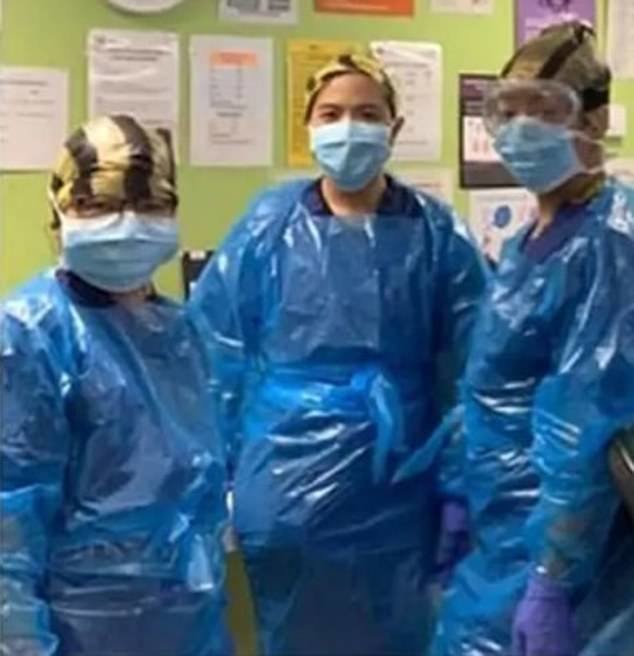 This image shows how nurses are wearing bin bags to cover their while treatments Covid-19 patients at a North West London hospital