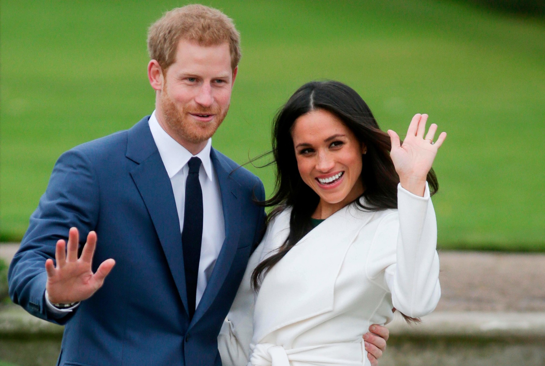 Meghan and Prince Harry wave outside Kensington Palace in 2017