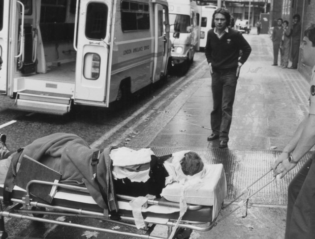 An injured soldier is pictured being taken to hospital after a nail bomb was detonated by the IRA outside the barracks in Chelsea in 1981