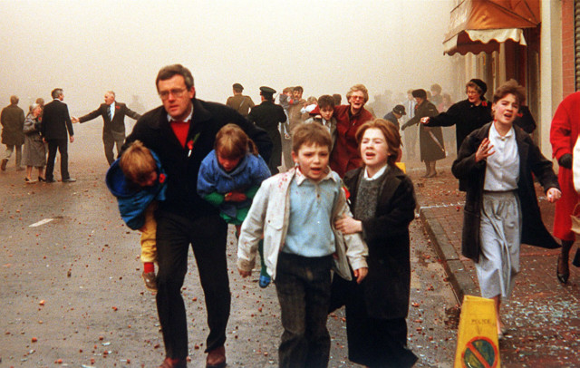 Terrified members of the public are caught up in the 1987 Poppy Day explosion in Enniskillen by the IRA