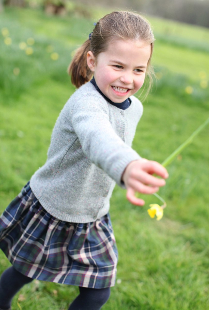 Charlotte pictured playing at the Cambridges' home of Anmer Hall in Norfolk