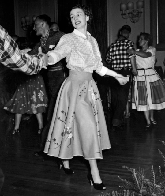A picture of Queen Elizabeth II - then Princess Elizabeth - dancing, aged 25, at Government House in Ottawa as she takes part in the country square dances during her tour of Canada with Prince Philip, October 18, 1951