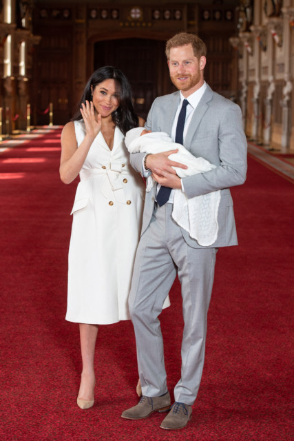 Prince Harry, Duke of Sussex and Meghan, Duchess of Sussex, pose with their newborn son Archie Harrison Mountbatten-Windsor in 2019