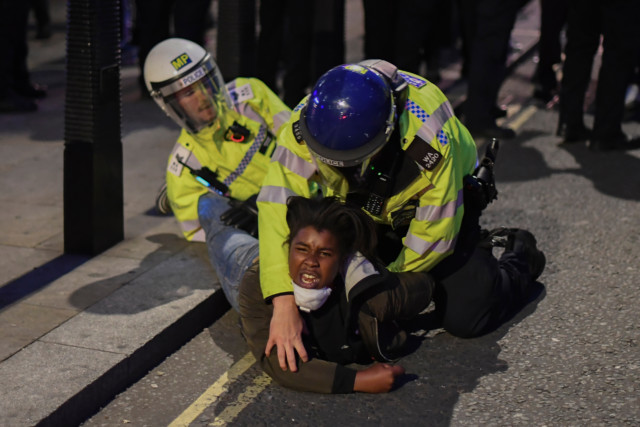 Police arrest a protester during a Black Lives Matter demonstration
