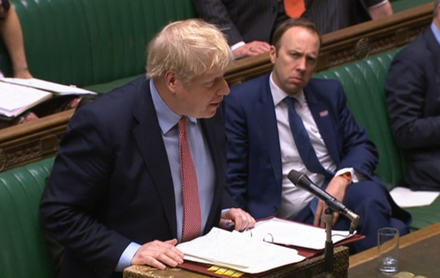  Boris Johnson and Matt Hancock sat closely together during PMQs on Wednesday - two days before they announced they had tested positive for Covid-19