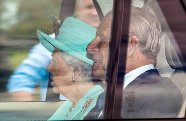 The Queen and Prince Philip were pictured being driven on the Long Walk in Windsor Great Park yesterday