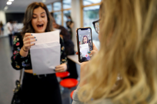  A student reacts as she checks her A-Level results at Ark Academ