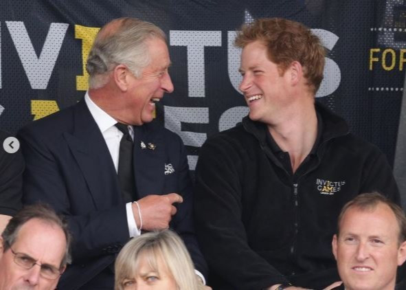 Clarence House also shared a photo of Harry laughing with his dad