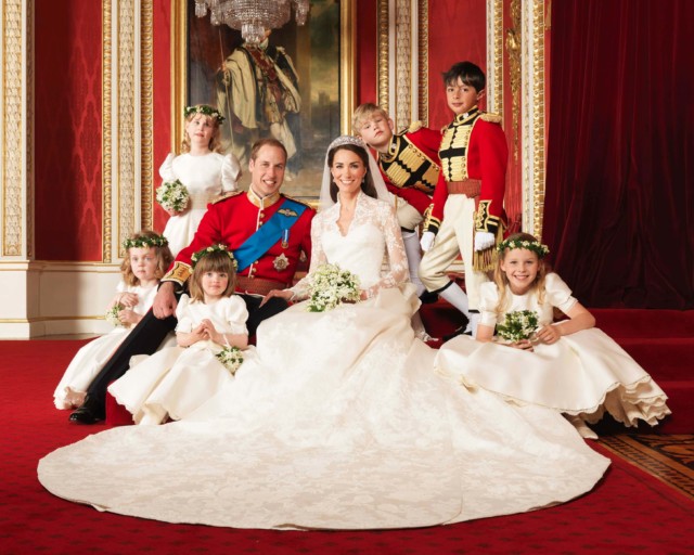  The newlyweds pose with their adorable flower girls and page boys inside Buckingham Palace