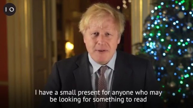 Boris Johnson last night joked he had a 'small present for anyone who may be looking for something to read' after their Christmas lunch
