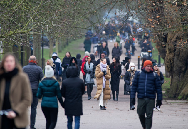 People out and about in a busy Greenwich Park, London, this afternoon 
