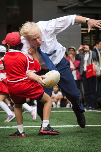 The pair collide as the London Mayor heads for the try line