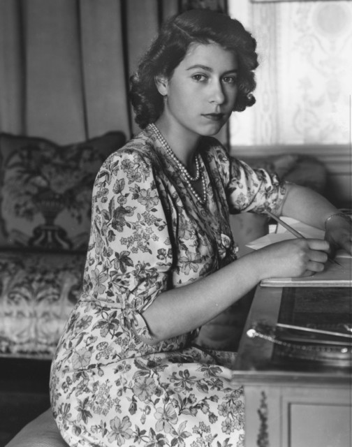 Princess Elizabeth, writing at her desk at Windsor Castle, on May 30, 1944, aged 18