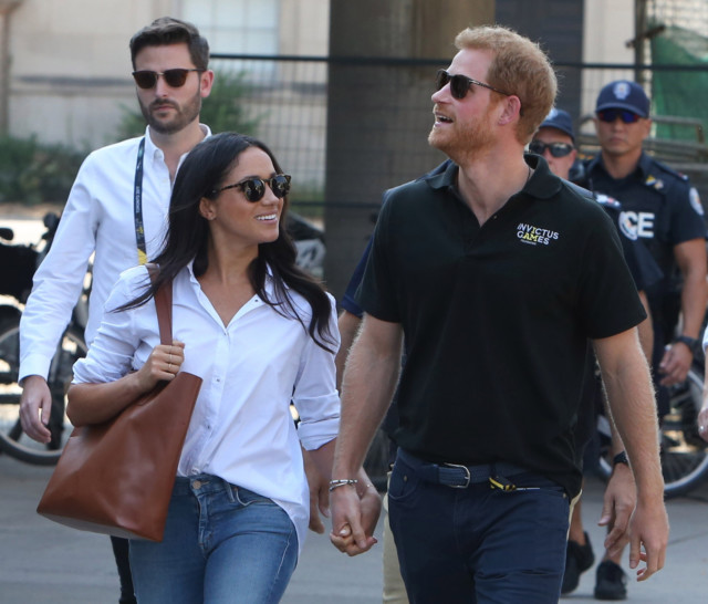 He says wife Meghan would cry herself to sleep at night before the Oprah interview aired in March