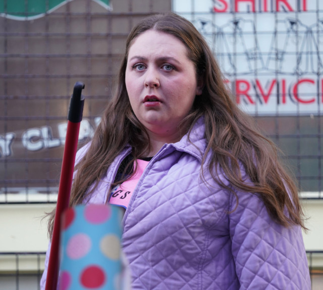 The EastEnders favourite teamed a purple jacket with a broom in this look