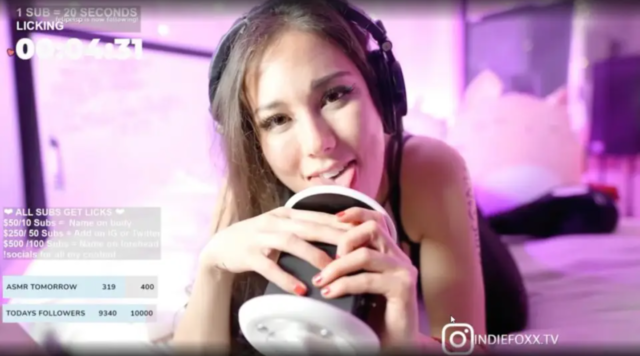 Popular Twitch streamer Indiefoxx licks her microphone during a stream