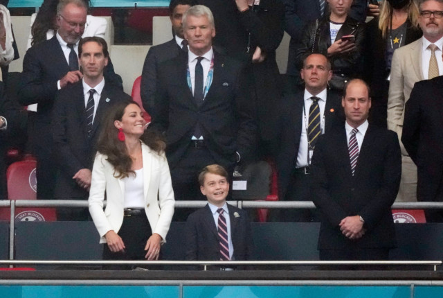 Prince William, Kate Middleton and Prince George in the stands before the match