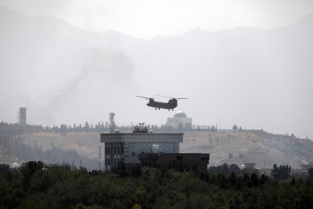 A Chinook helicopter flies over the US Embassy in Kabul, Afghanistan