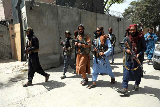 Taliban fighters patrol in Wazir Akbar Khan neighbourhood in the city of Kabul Credit: AP