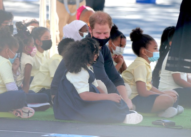 The Duke seen laughing with a little girl during Meghan's reading