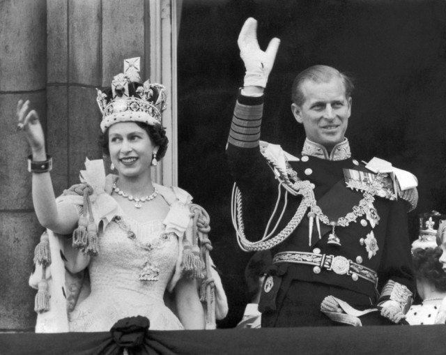 The Queen and the Duke of Edinburgh wave from Buckingham Palace after the Queen's coronation