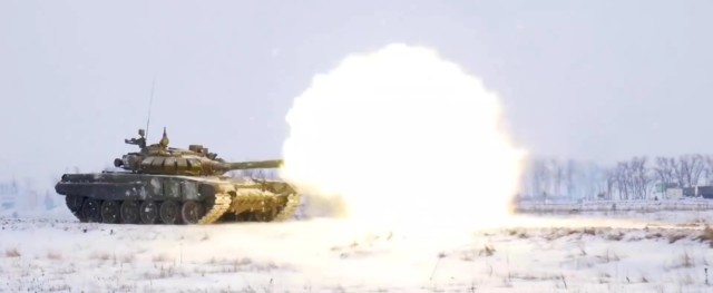 Russian tanks take part in a military drill
